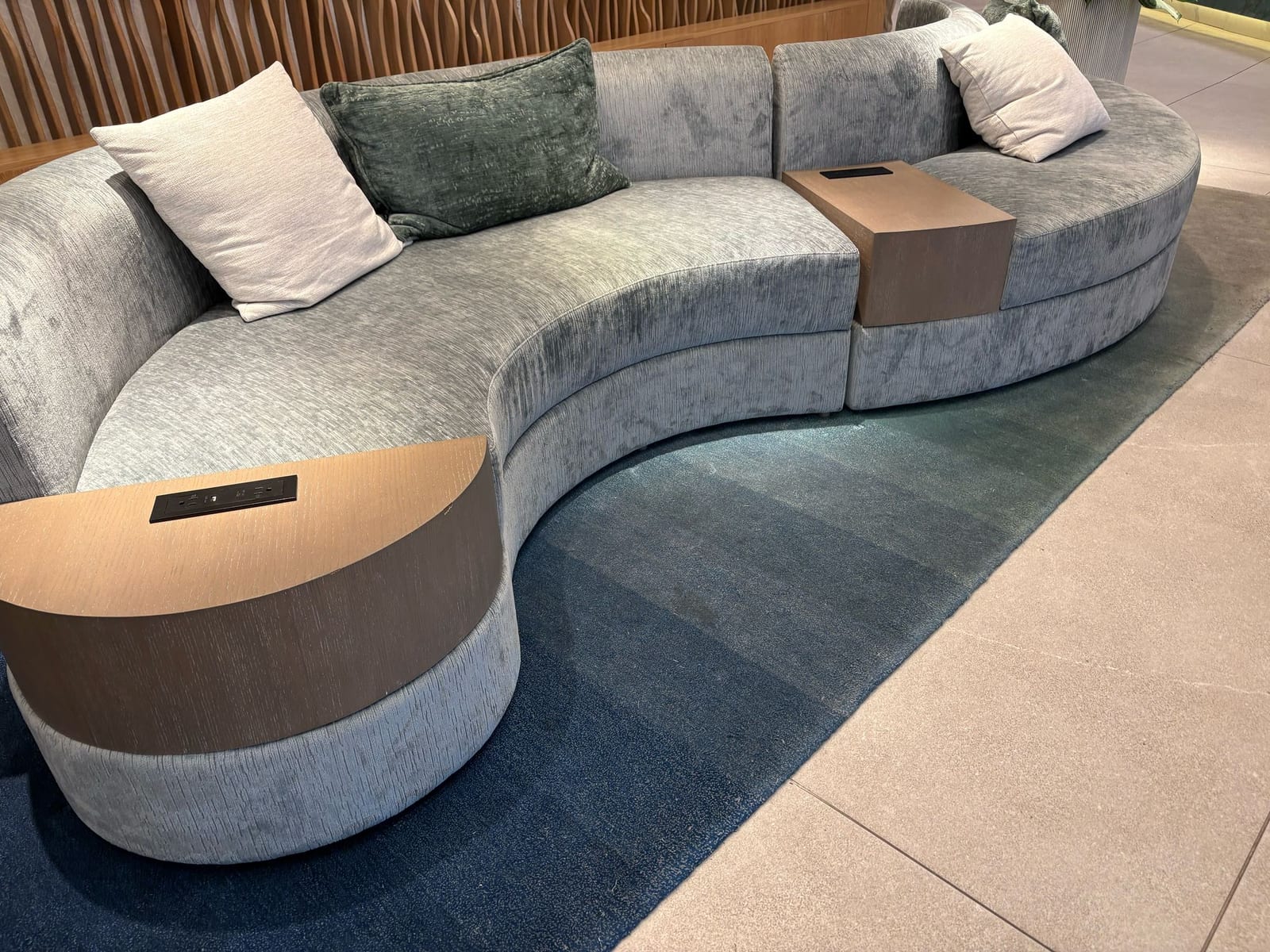 Serpentine sectional with integrated wood tables