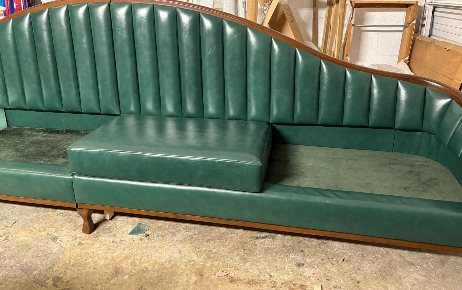 Channel-tufted leather banquette with wood trim
